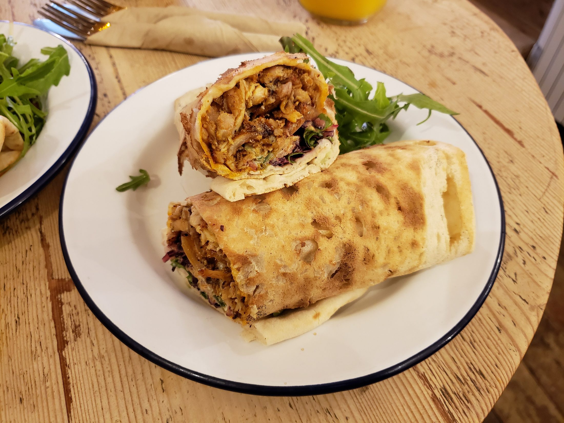 Chicken Shawarma โ Marinated for hours, seared golden, wrapped in warm bread with pickles and garlic sauce.