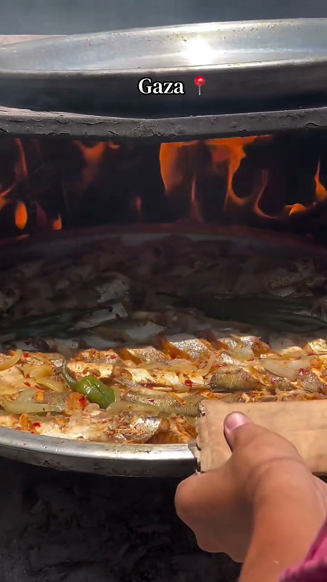 Oven-Baked Fish Tray โ Whole fish marinated in garlic, lemon and warm spices, roasted over onions, tomatoes and peppers.